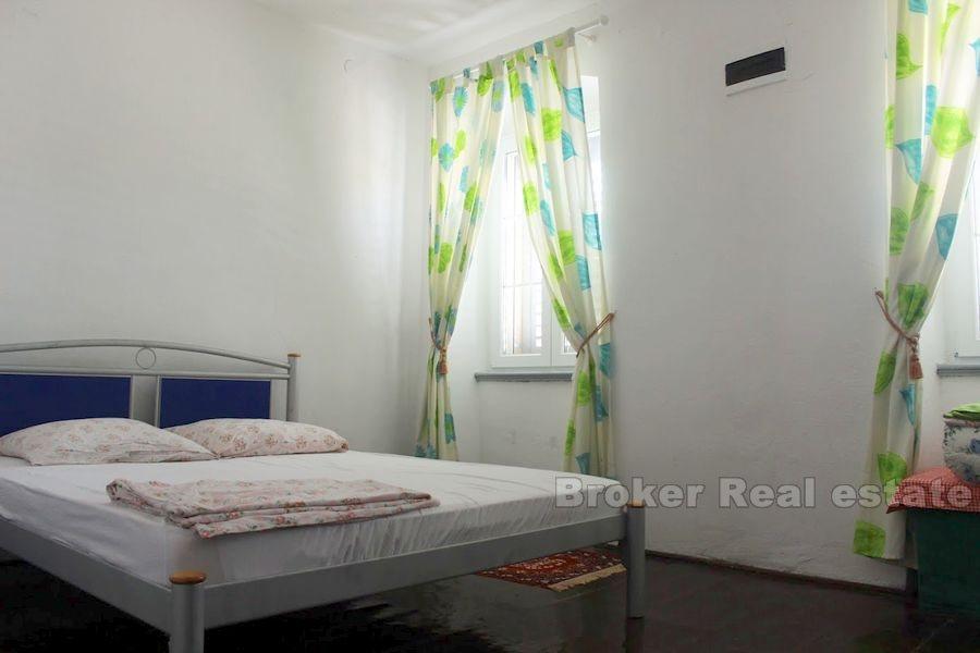 Seafront stone house on island near Sibenik, for sale