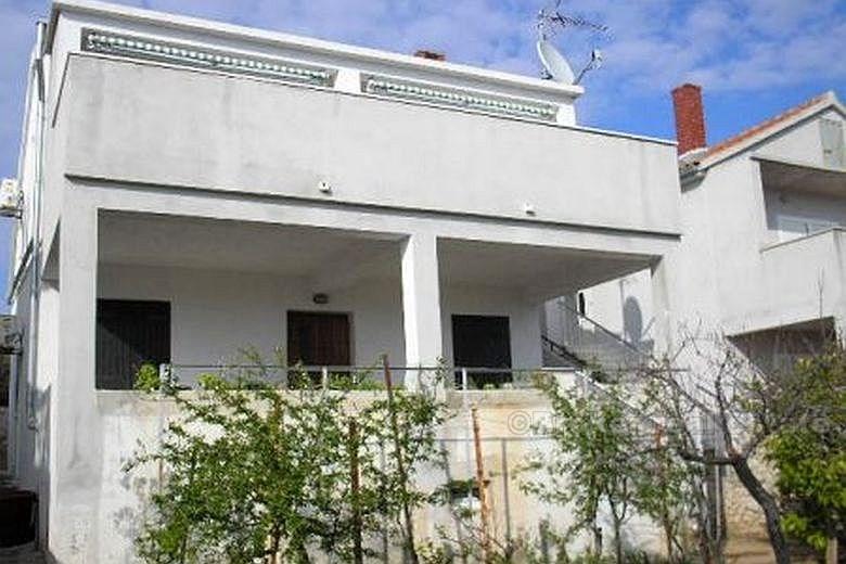 Detached house, second row from the sea