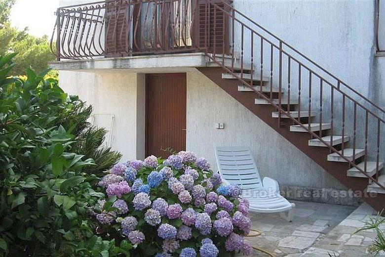 Detached house with three apartments