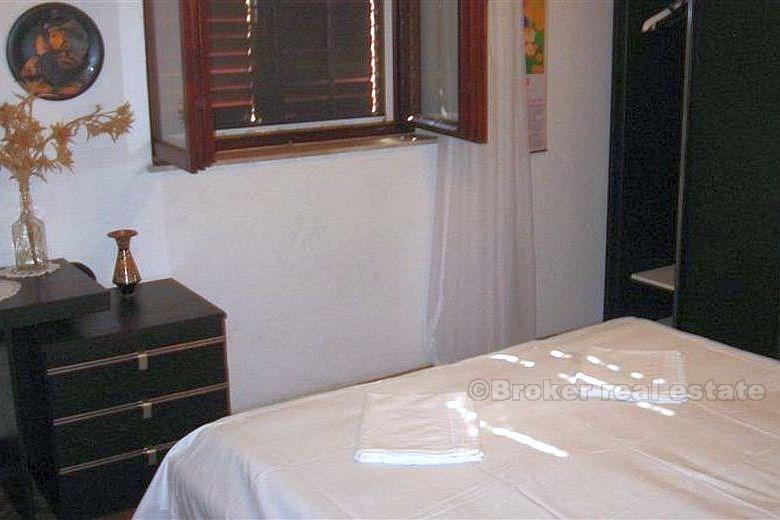 Detached house with three apartments