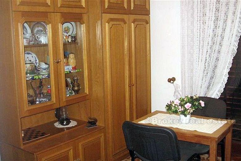 Detached house with three apartments