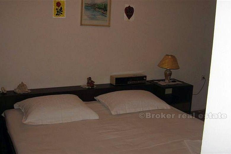 Detached house with three apartments