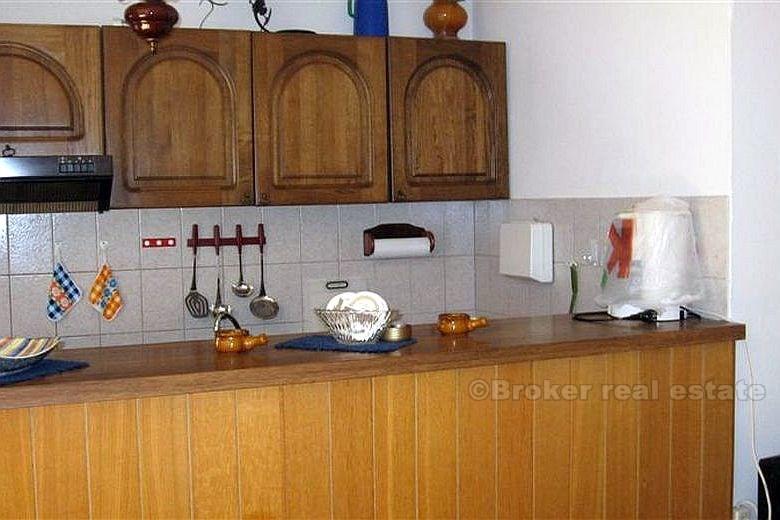 Detached house with three apartments