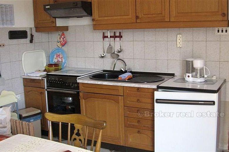 Detached house with three apartments