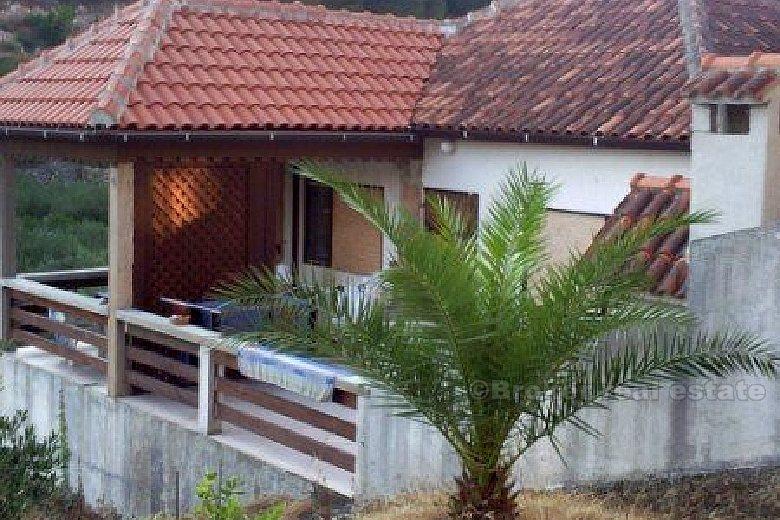 Small house in a quiet bay, for sale