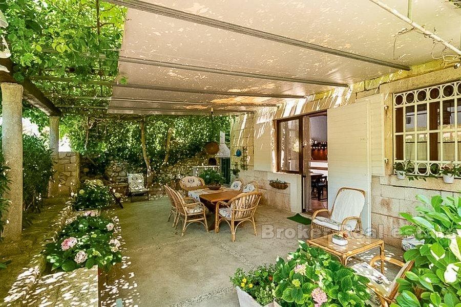 Two units in a stone house, for sale