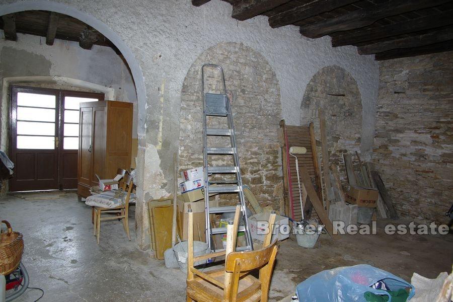 Old stone house in first row to the sea