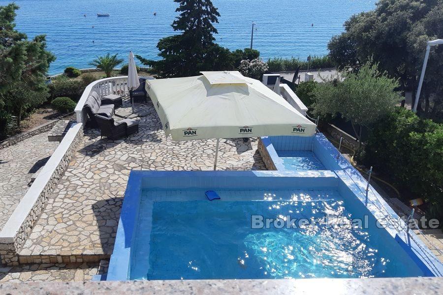 House with pool, first row to the sea