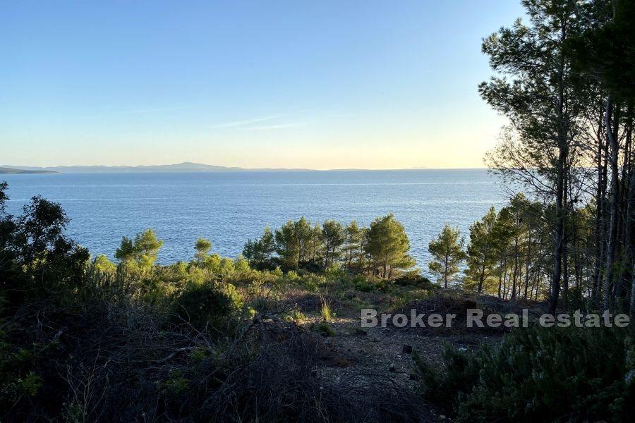 Building plot with a project and a view of the sea