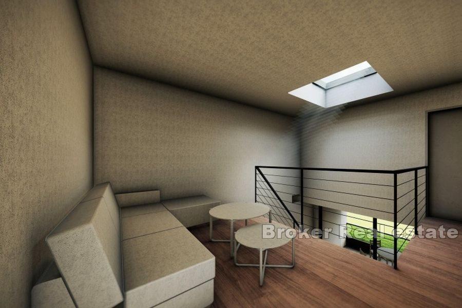 Byggetomt med prosjekt og utsikt over havet