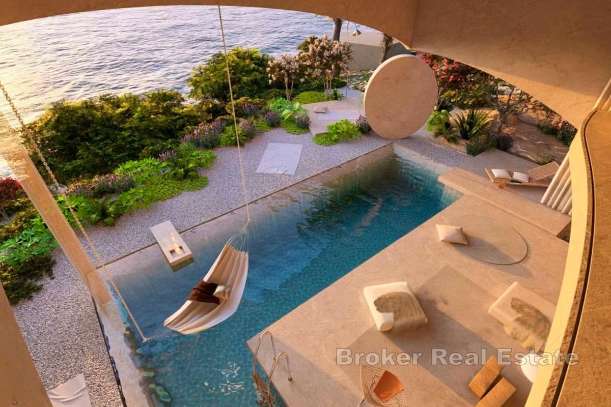 Terrain constructible avec projet de villa de luxe, en bord de mer