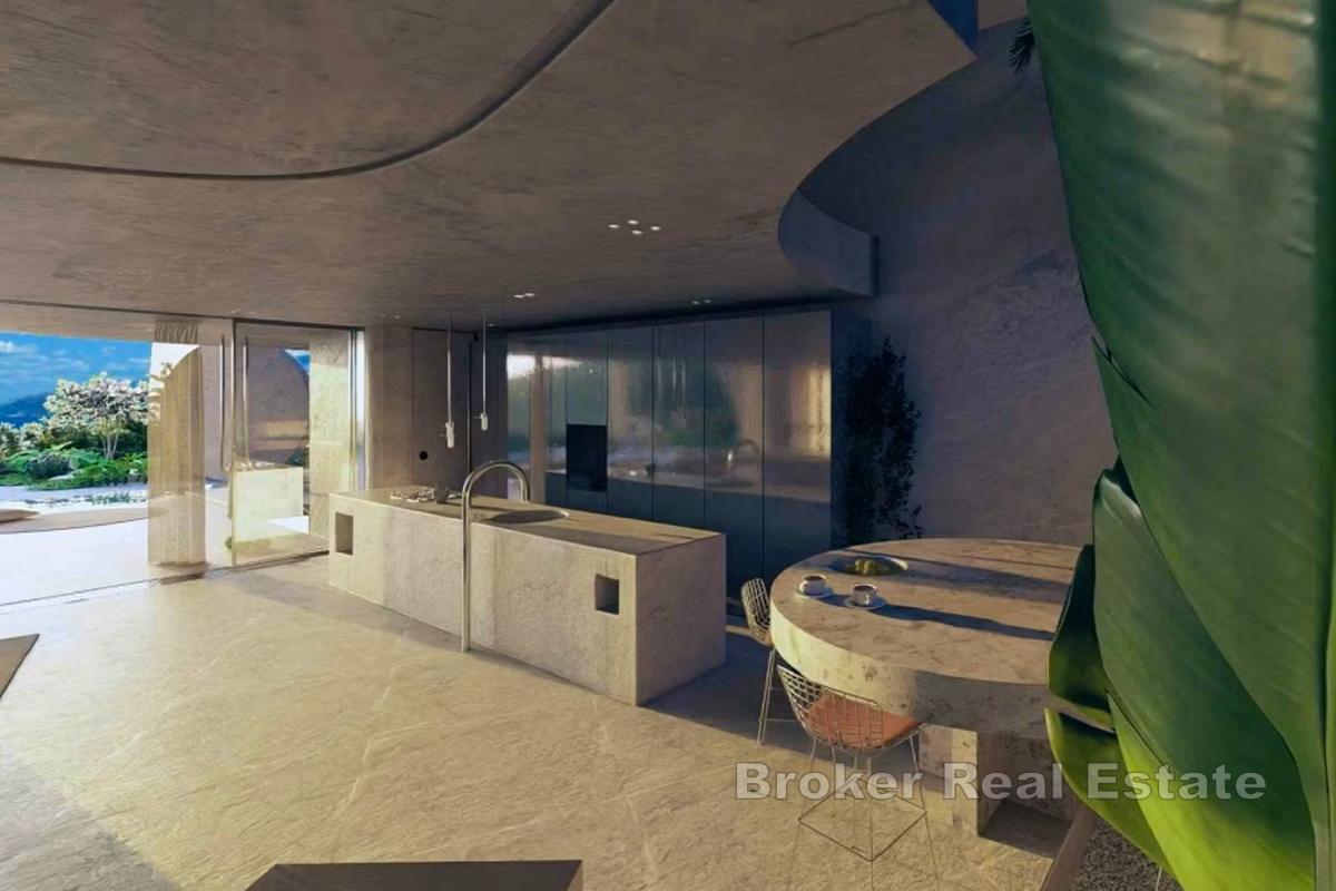 Terrain constructible avec projet de villa de luxe, en bord de mer