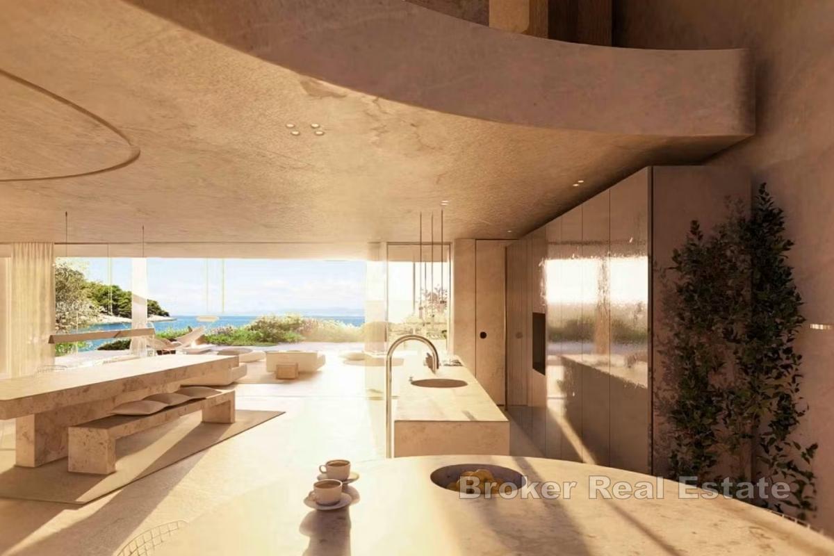 Terrain constructible avec projet de villa de luxe, en bord de mer