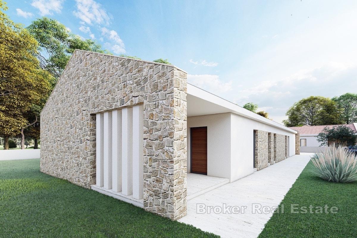 Několik stavebních pozemků s projekty